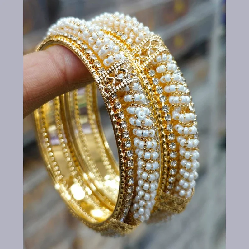 Discounted Luxury Jewelry – Shine Without The Splurge Pooja Bangles Gold Plated Austrian And Pearl Bangles Set Discounted Luxury Jewelry – Shine Without The Splurge Pooja Bangles Gold Plated Austrian And Pearl Bangles Set